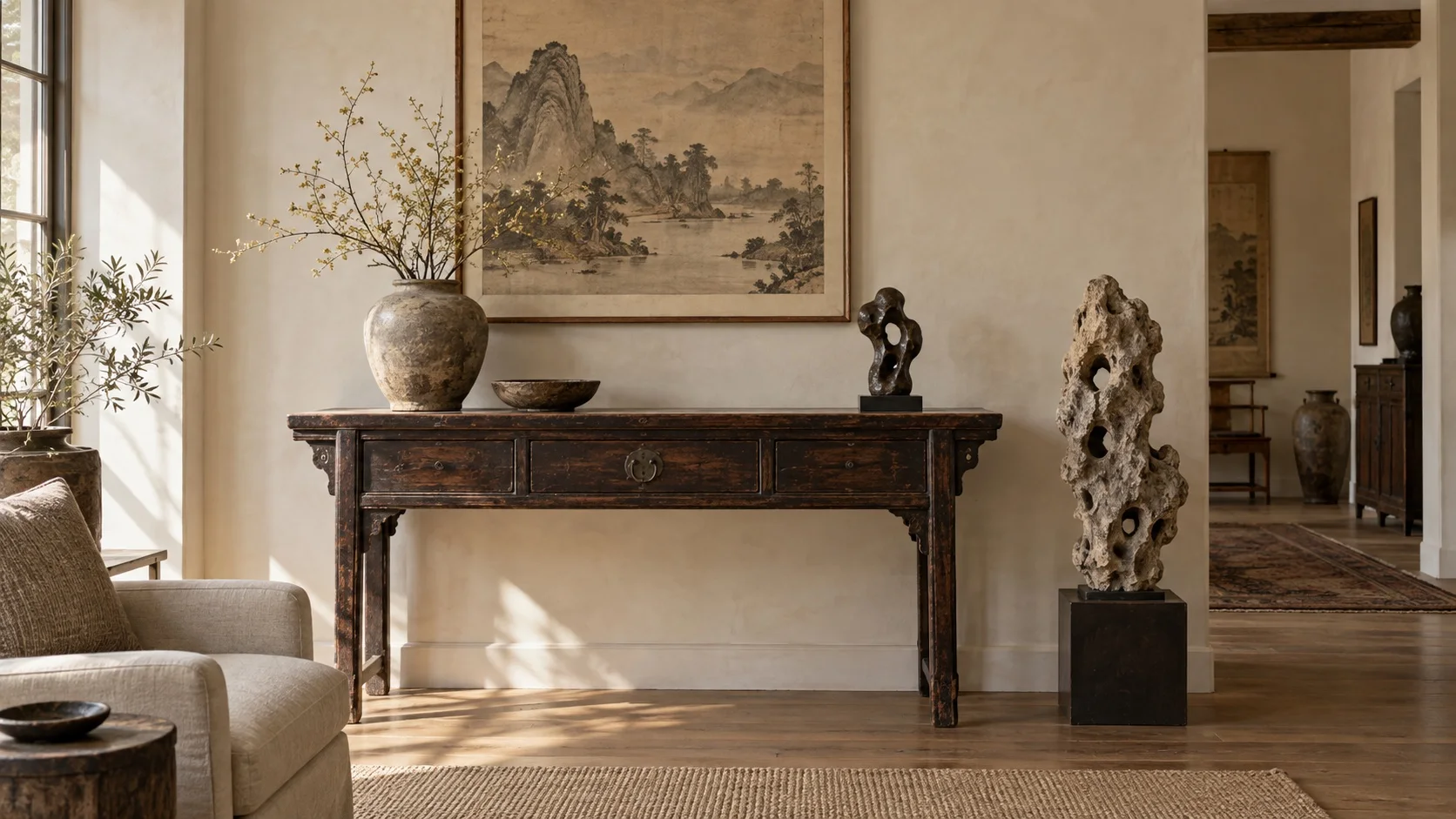 Antique elm console with ink landscape art, aged ceramics and a sculptural scholar's stone